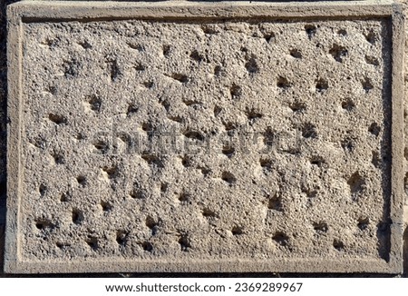 The texture of old concrete with holes is messy