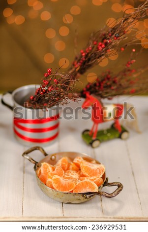 Christmas horse toy and mandarin slices