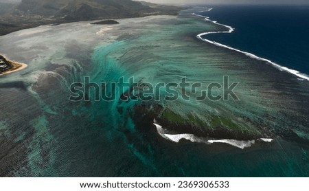 Aerial view of Le Morne beach with beautiful blue lagoon and underwater waterfall illusion