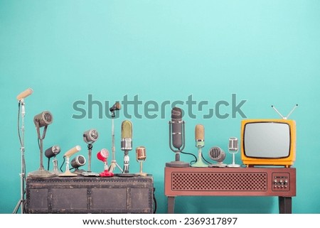 Microphones set and classic television. Retro style filtered photo