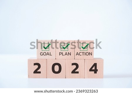 Wooden cubes with 2024 and goal, plan, action icon on white background. 2024 goals of business or life. Starting to new year. Business common goals for planning new project, annual, target achievement Royalty-Free Stock Photo #2369323263