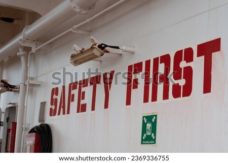 safety warning sign on the bulkhead at the muster station of a ship