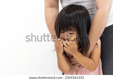 A girl (3 years old, Japanese) whose mouth is covered from behind. kidnapping image