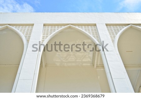 Arabian arches in Mosque, Eid Mubarak Islamic background. Royalty-Free Stock Photo #2369368679