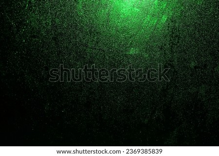 Black dark green shiny glitter abstract background with space. Twinkling glow stars effect. Like outer space, night sky, universe. Rusty, rough surface, grain.