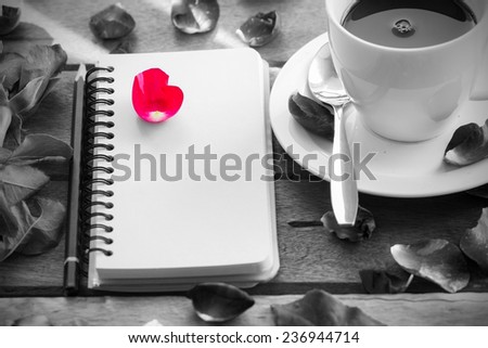  Note Pad and Pencil with flowers on Wood Table Surface. black and white