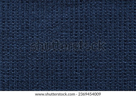Dark blue jersey fabric pattern close up as background