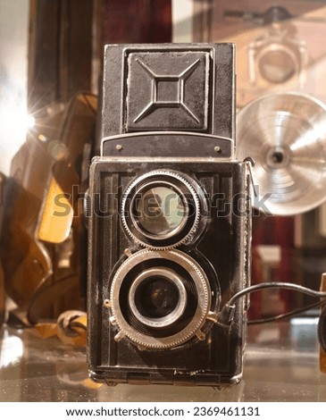 Classic old black camera, used intensively, selective focus