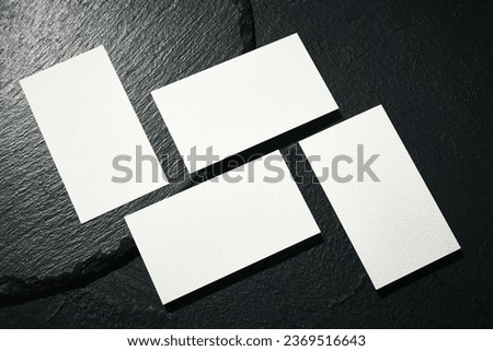 Business blank card mockup template. Design presentation layouts for corporate identity, advertising, personal, stationery over black background. Concept of occupation, entrepreneurship.