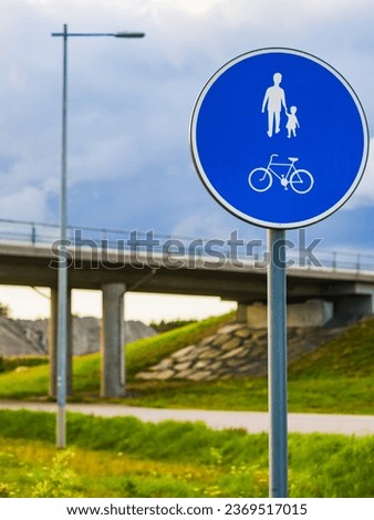 Circular shared cycling and walking sign of bike and pedestrian person walking.