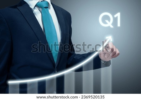 Businessman in suit drawing business growth data chart with diagram, report on company investment progress, quarterly report, Q1 first quarter Royalty-Free Stock Photo #2369520135