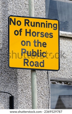 AA Street sign prohibiting the running of horses on the public road