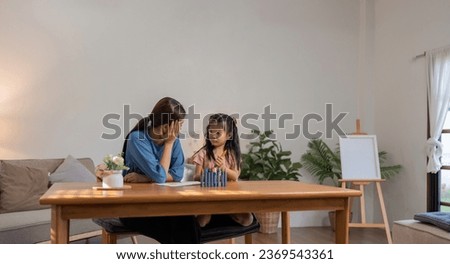 Mother and her daughter draw in the paper together, Leisure activities, holiday