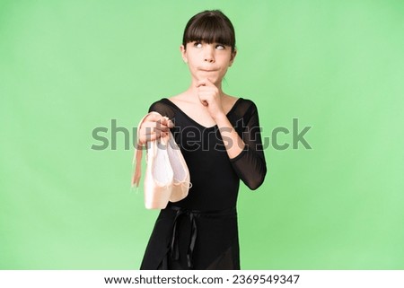 Little caucasian girl practicing ballet over isolated background having doubts and thinking
