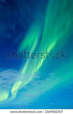 Sky background with northern lights. Aurora borealis. Northern lights as a background. Night winter landscape with aurora. Natural background.