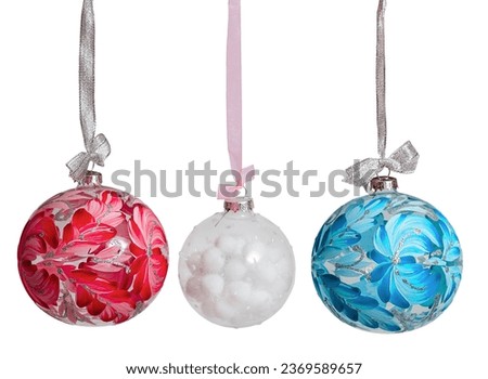 New Year's Christmas balls of pink blue white color on a white background isolated. Christmas Baublehang on a ribbon with a bow.