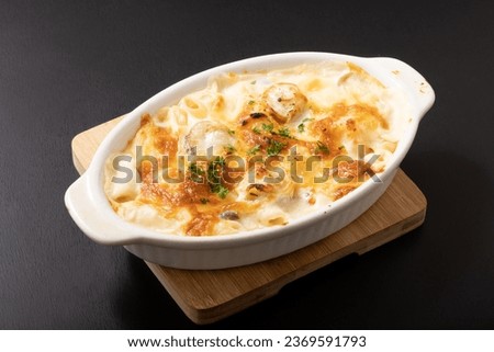 Baby scallop macaroni gratin image Royalty-Free Stock Photo #2369591793