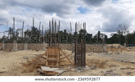 The chicken claw foundation (footplate) consists of a concrete slab as a base with an iron frame to strengthen the building structure Royalty-Free Stock Photo #2369592877