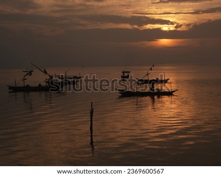 Sunset on the coast of Kenjeran beach, Surabaya city - Indonesia.