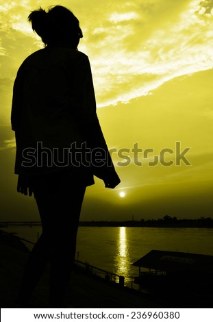 sun rise with girl siluate scene abstract,yellow color tone
