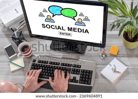 Man using a computer with social media concept on the screen