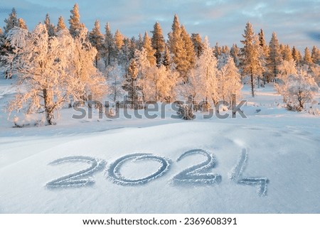2024 written in the snow, winter landscape greeting card Royalty-Free Stock Photo #2369608391