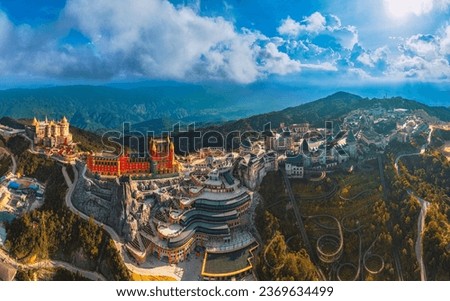 Aerial Panorama view of lunar castles and French village on the top of Ba Na Hills, streets and campuses at the famous tourist destination of Da Nang, Vietnam. Near Golden bridge. Royalty-Free Stock Photo #2369634499