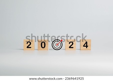 Wooden block with business goals in 2024. key performance indicator and business achievement goal concept.