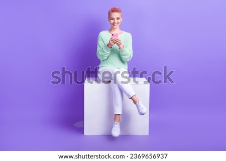 Full length photo of pretty cute lady dressed teal pullover texting modern device isolated purple color background