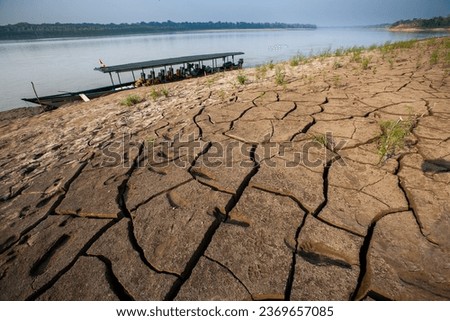 Like many rivers in the Amazon Rainforest, the Tambopata River can be affected by seasonal variations in water levels, including droughts Royalty-Free Stock Photo #2369657085