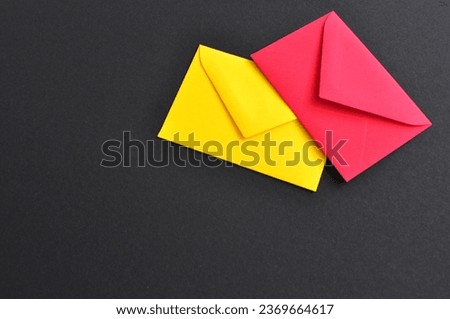 pink and yellow letters on black background 