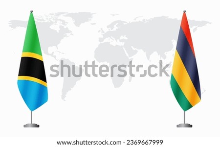 Tanzania and Mauritius flags for official meeting against background of world map.