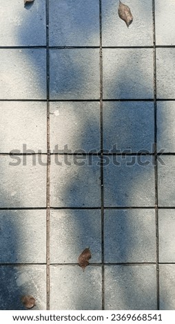 Abstract pattern of natural andesite stone for a car garage in the photo during a sunny day