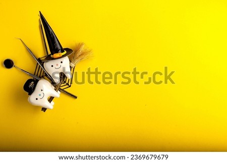 dentistry.dental.halloween. holiday concept. holidays. dentist.character for dentist halloween card.dental concept. figurines of teeth in halloween costumes and dental instruments. pumpkins and broom