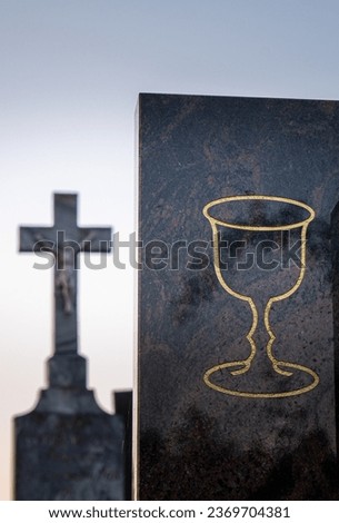 The cross and chalice are symbols of Christianity.