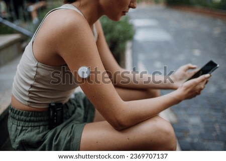 Beautiful diabetic woman preparing for outdoor workout in the city. Royalty-Free Stock Photo #2369707137