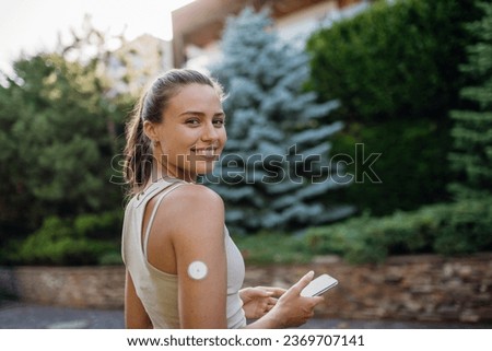 Beautiful diabetic woman preparing for outdoor workout in the city. Royalty-Free Stock Photo #2369707141