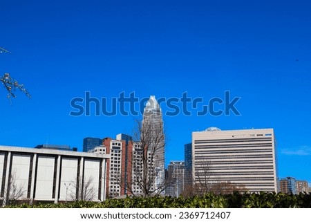a gorgeous shot of skyscrapers, office buildings and hotels in the city skyline with a blue sky in downtown Charlotte North Carolina USA	