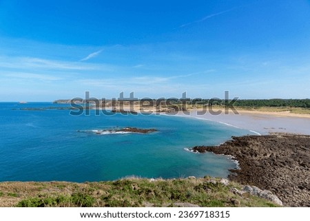 Turquoise waters and golden sand of the Anse du Croc beach in the Côtes d'Armor - Brittany

