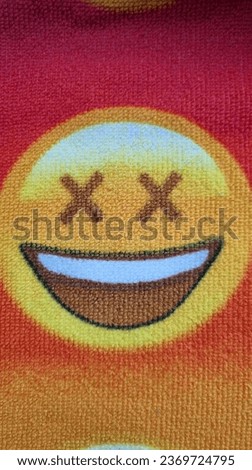 This is image of emoji, fabric print. Mobile shot 
