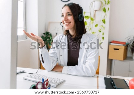 Young nutritionist female giving consultation to patient and making diet plan through meeting on video call. Healthy lifestyle, nutrition and diet concept. Royalty-Free Stock Photo #2369730717