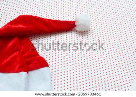 Santa Claus hat with white background and red polka dots