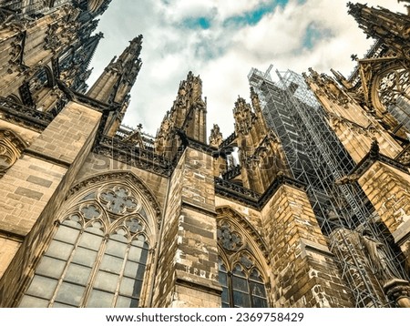 Partial view looking up at the majestic Cologne Cathedral in Cologne, Germany. It is the world’s third largest Gothic-style cathedral, Germany's most popular landmark and a UNESCO World Heritage Site.