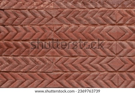 Red brick coloured tile background  with sideways chevrons