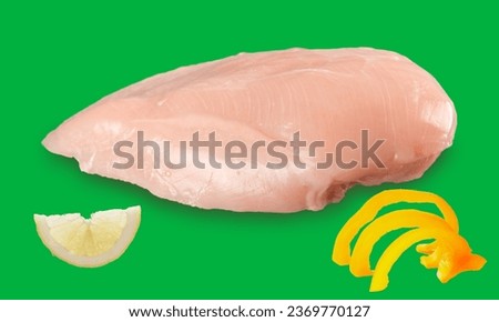 Raw Chicken breast on green screen with lime slice and bell paper
