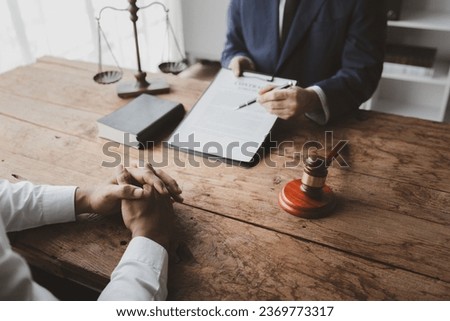 Lawyers provide legal advice. Clients who are being prosecuted by other parties receive counseling to fight cases with lawyers, fighting cases in court in transparent and legal manner. Lawyer concept. Royalty-Free Stock Photo #2369773317