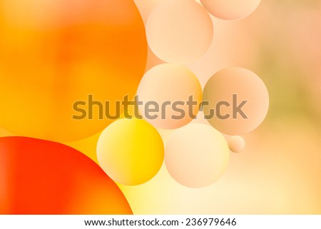 Colorful oil drops on a water surface for background