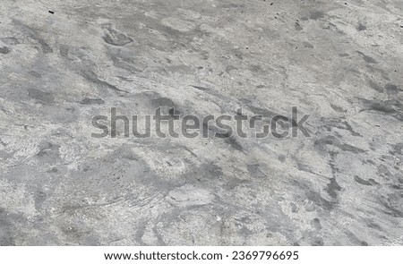 the texture of the concrete floor.