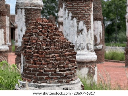 a stack of bricks in the garden.