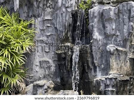a waterfall in a rock formation.
